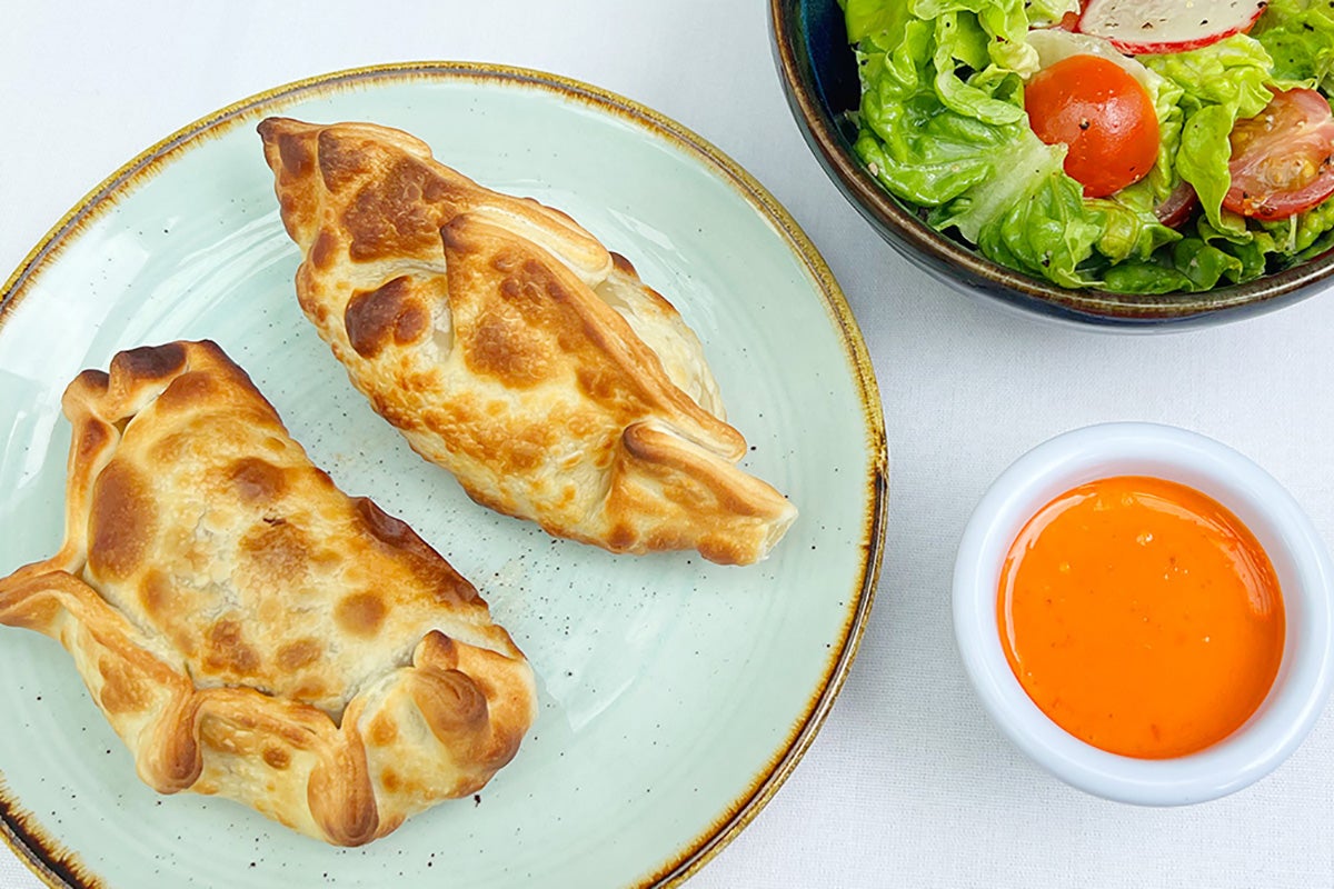 Two empanadas with salad