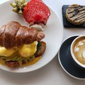 CROISSANT EGG BENEDICT WITH AVOCADO AND COFFEE