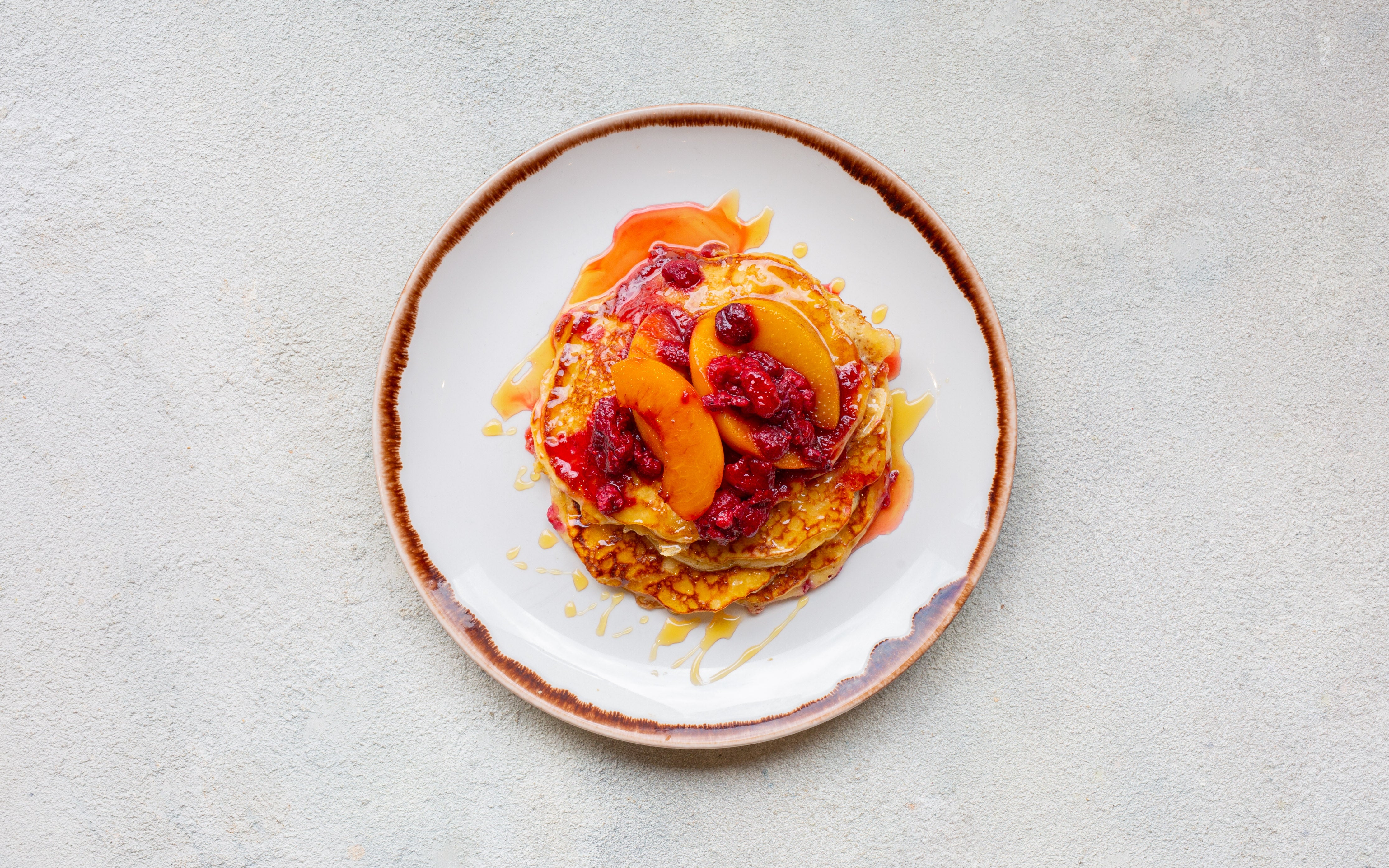 3 Pancake Stack with Maple Syrup raspberries & grilled peach
