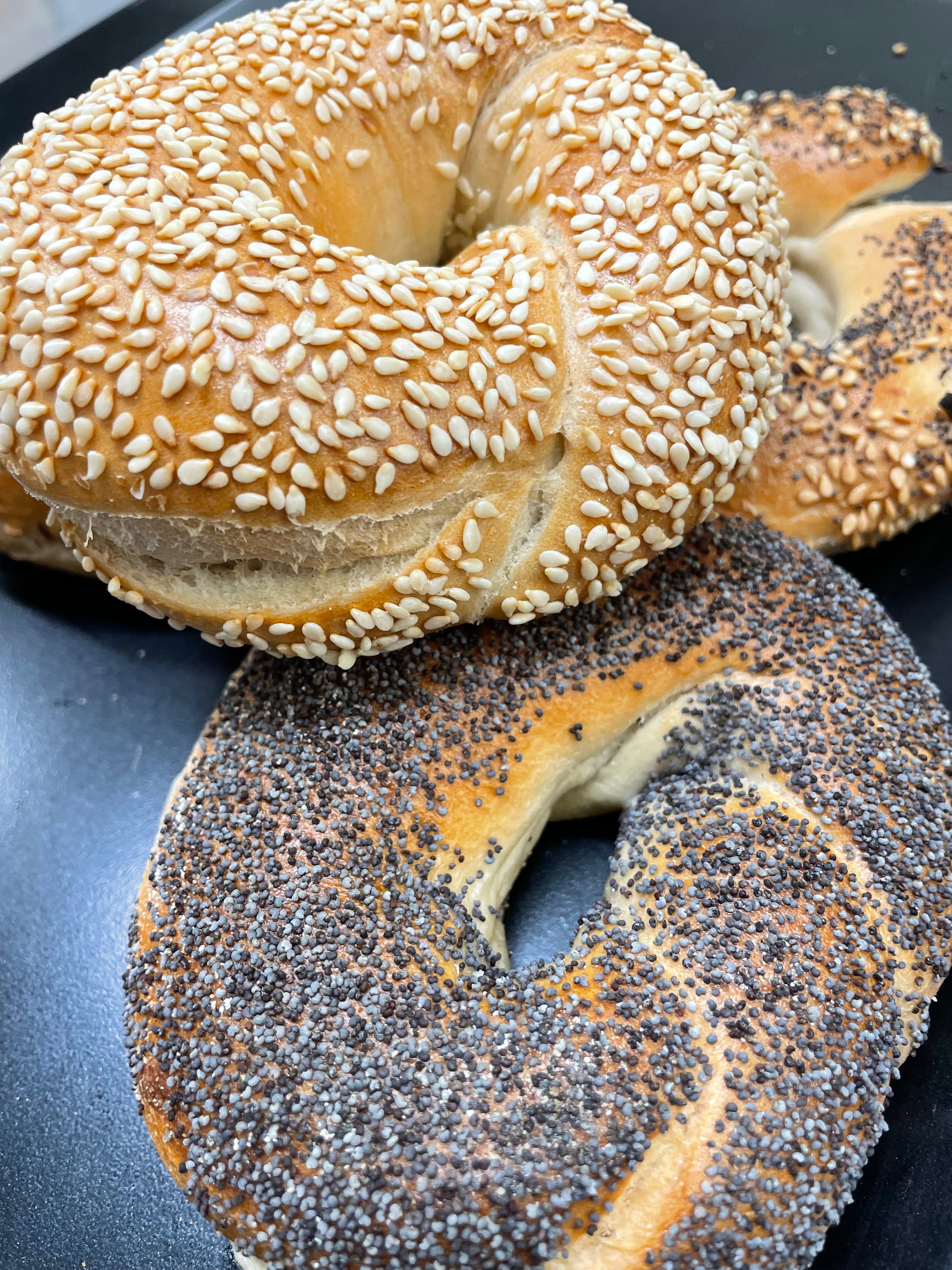 Toasted bagel with cream cheese and pickles