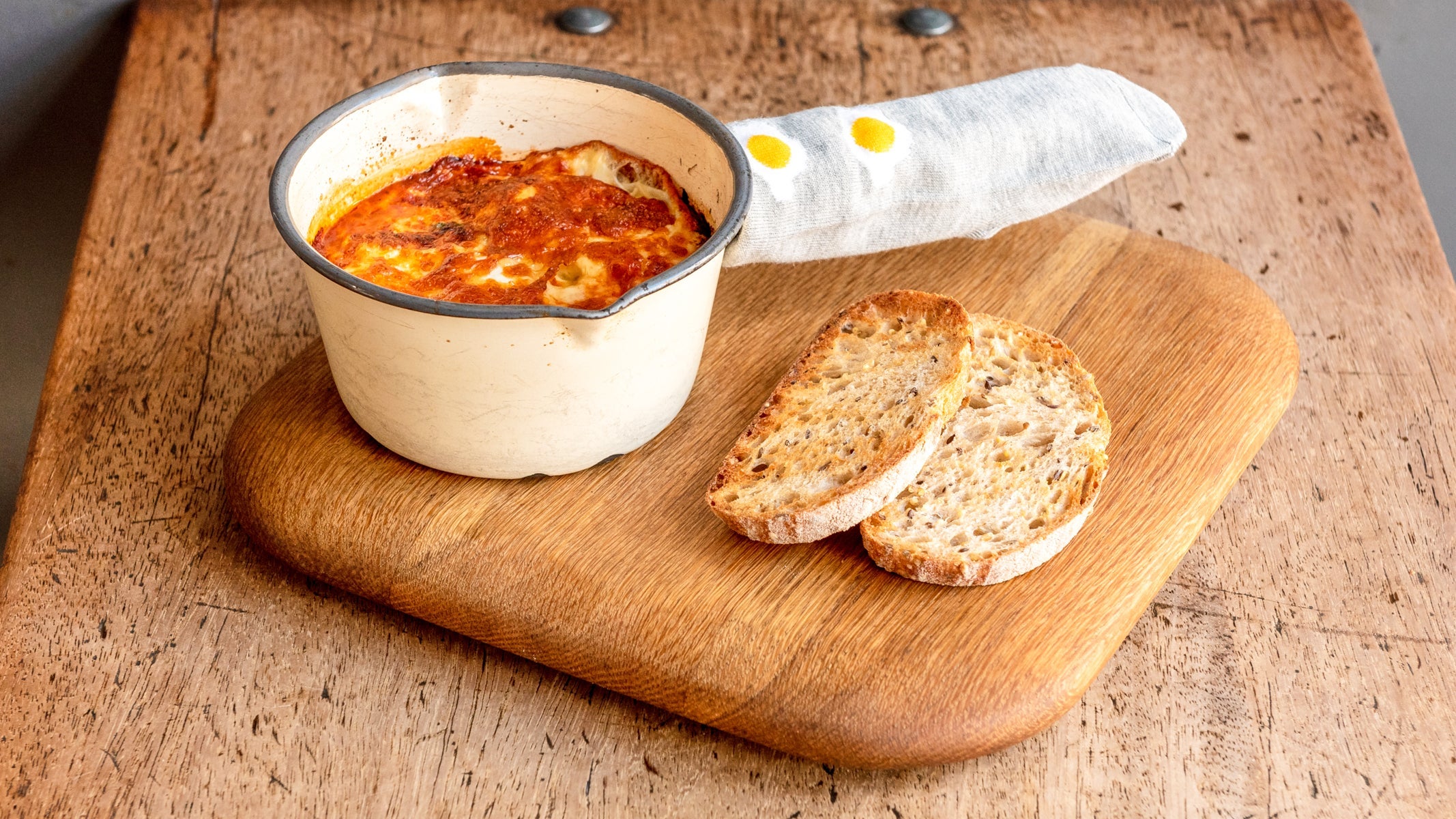 Baked Eggs with A Chorizo, Mushroom, Spinach & Tomato Sauce Topped with Cheddar Cheese & Toast