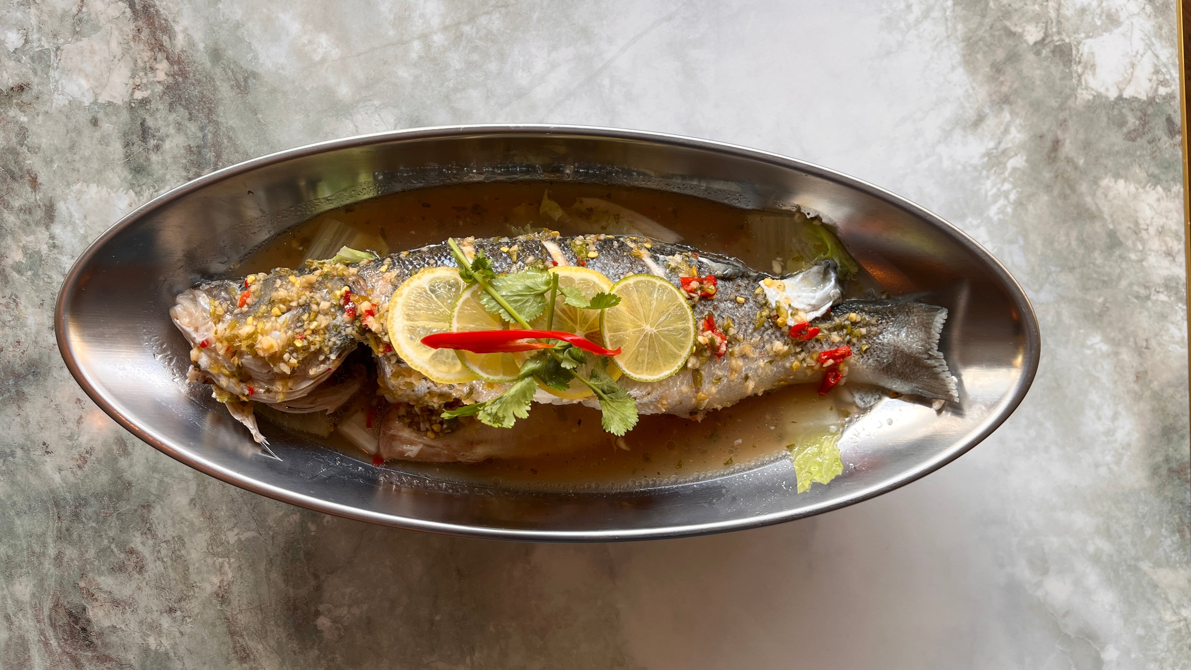 Steamed Seabass- spicy and sour lime and garlic sauce