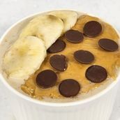 Overnight Oats With Peanut Butter , Banana Slices And Dark Chocolate Chips 