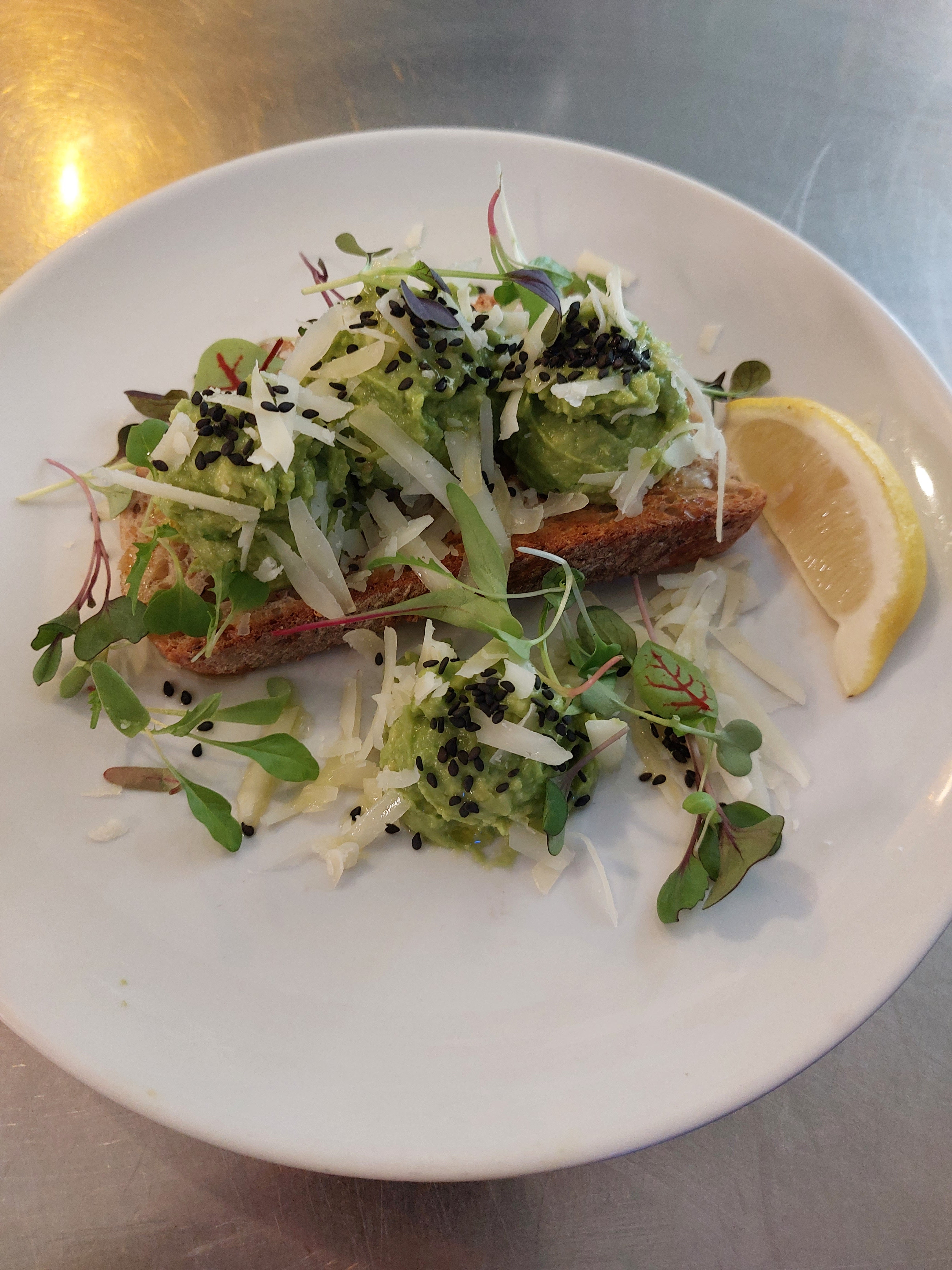 Smashed Avocado, Manchego Cheese, Black Sesame Seeds, Smoked Olive Oil & Lemon on Toast
