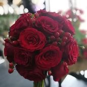 A Bouquet Of Red Flowers In A Spherical Shape