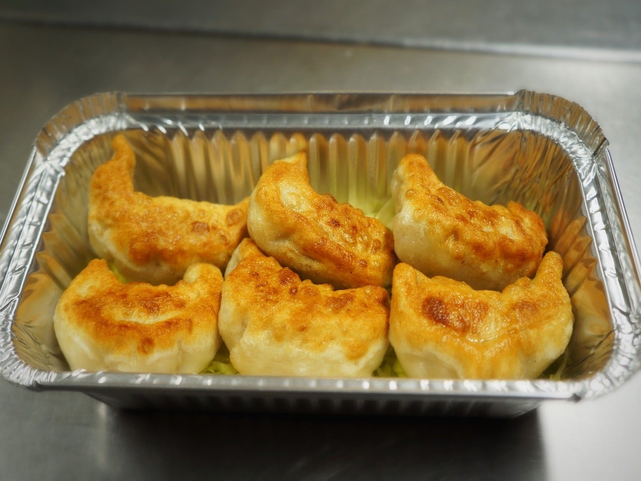 (10a) 鍋貼 - Grilled Dumplings
