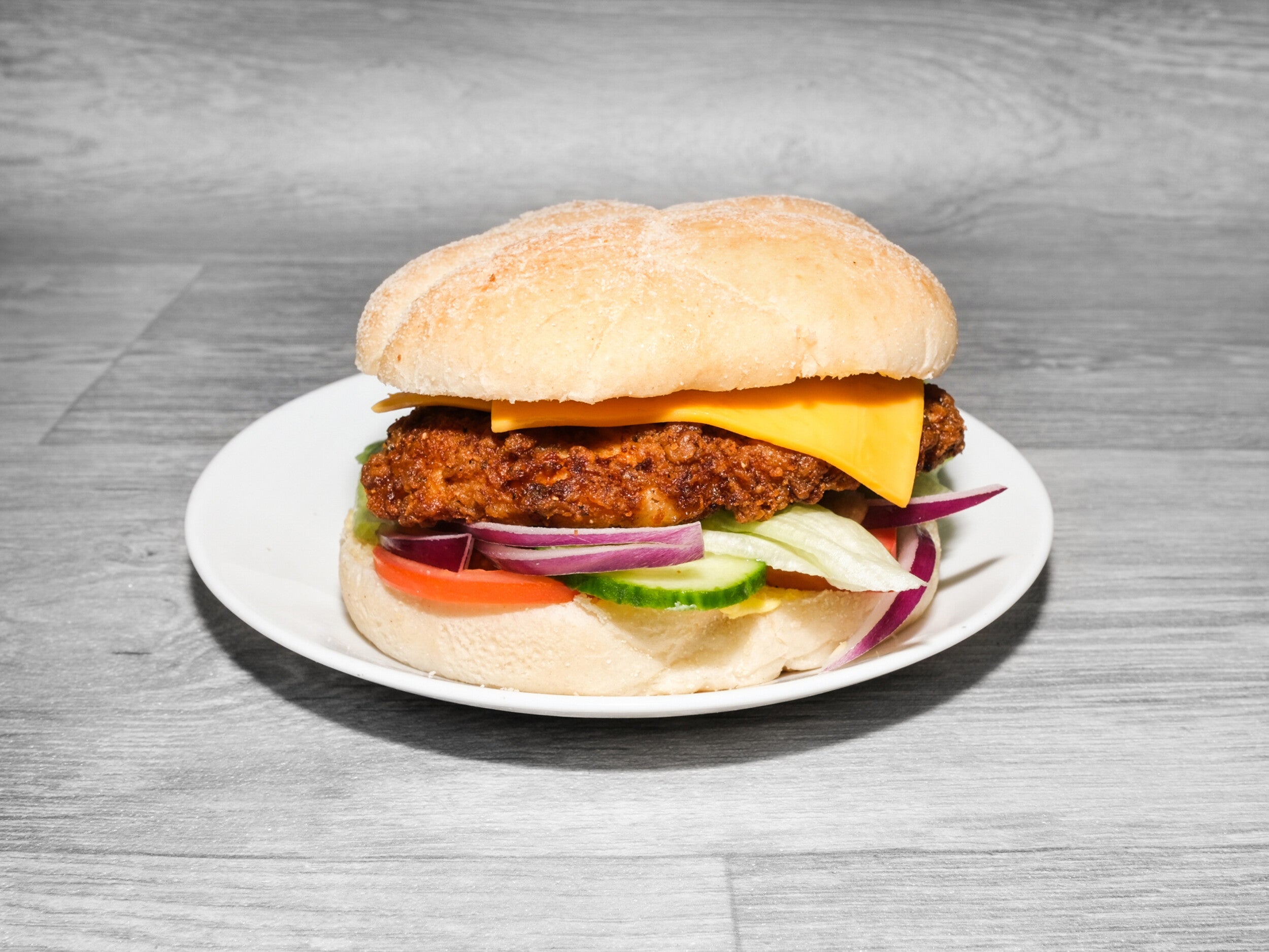 Spicy Chicken Burger, Cheese, and Salad