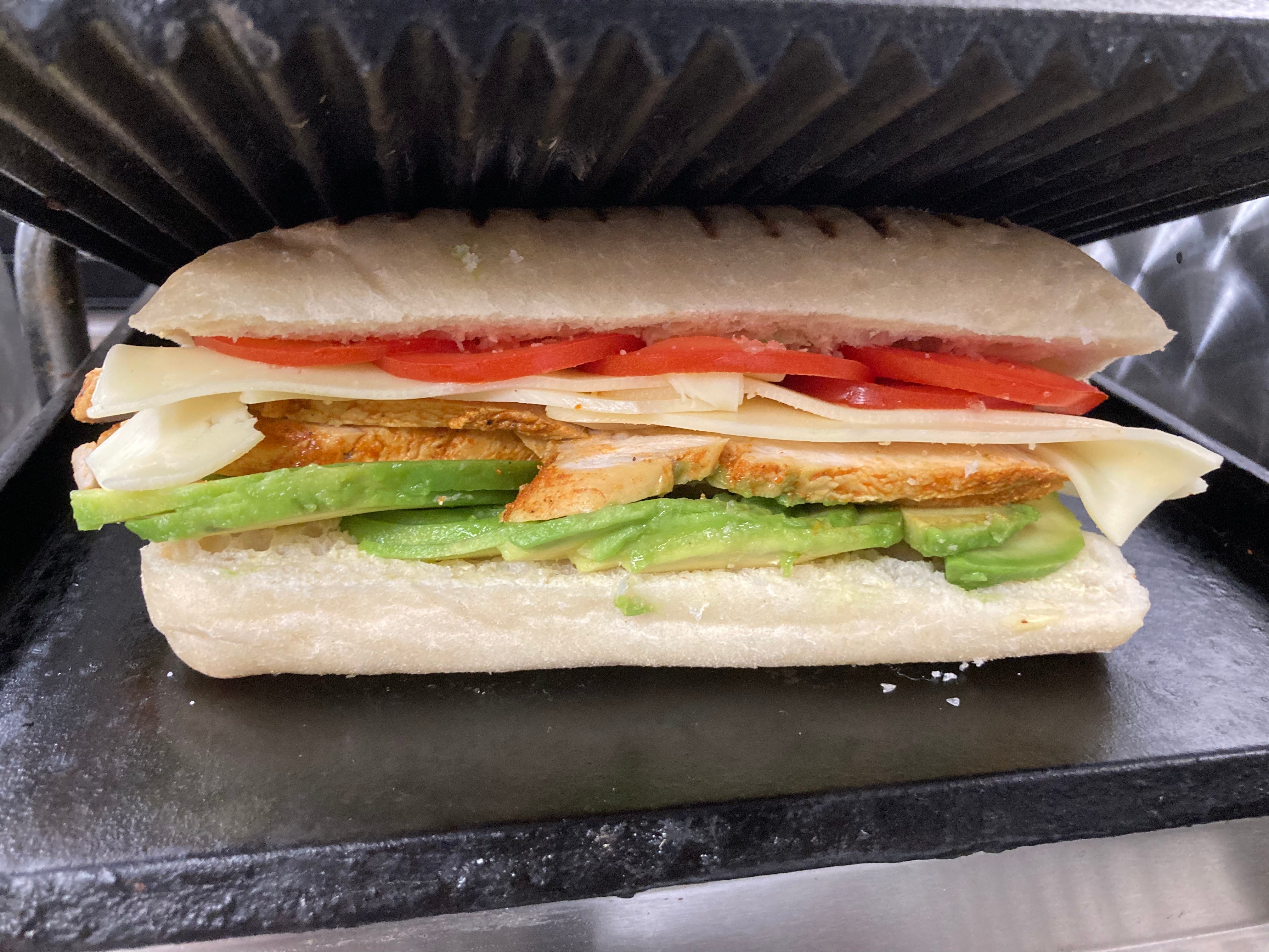 Crispy chicken ,avocado ,cheese and tomato  panini