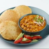 6 Poori With Chole  Bhaji Served With Green Chili And Salad