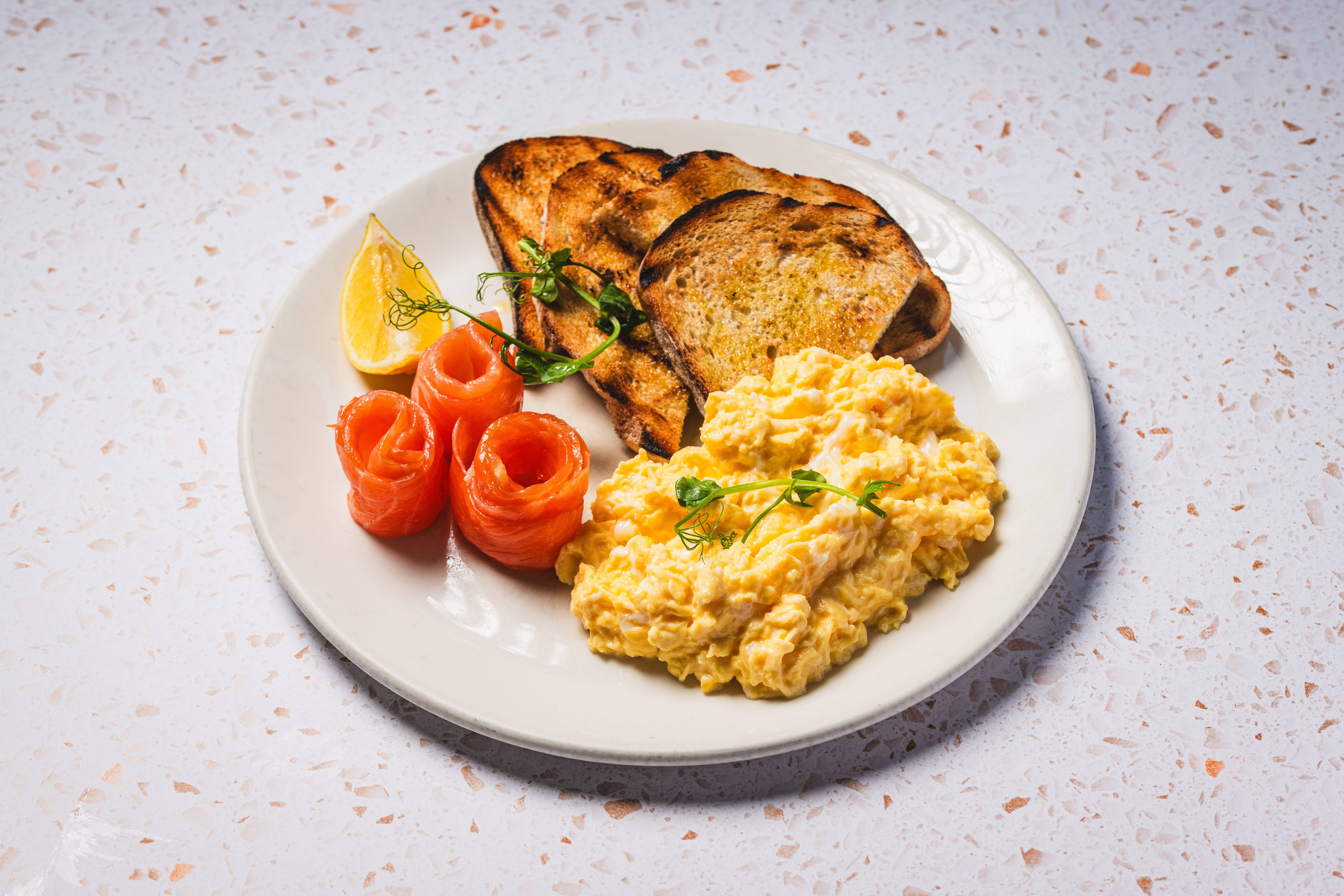 Scrambled eggs, smoked salmon and toast.