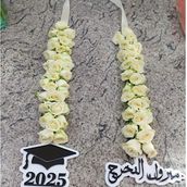 White And Acrylic Graduation Baby