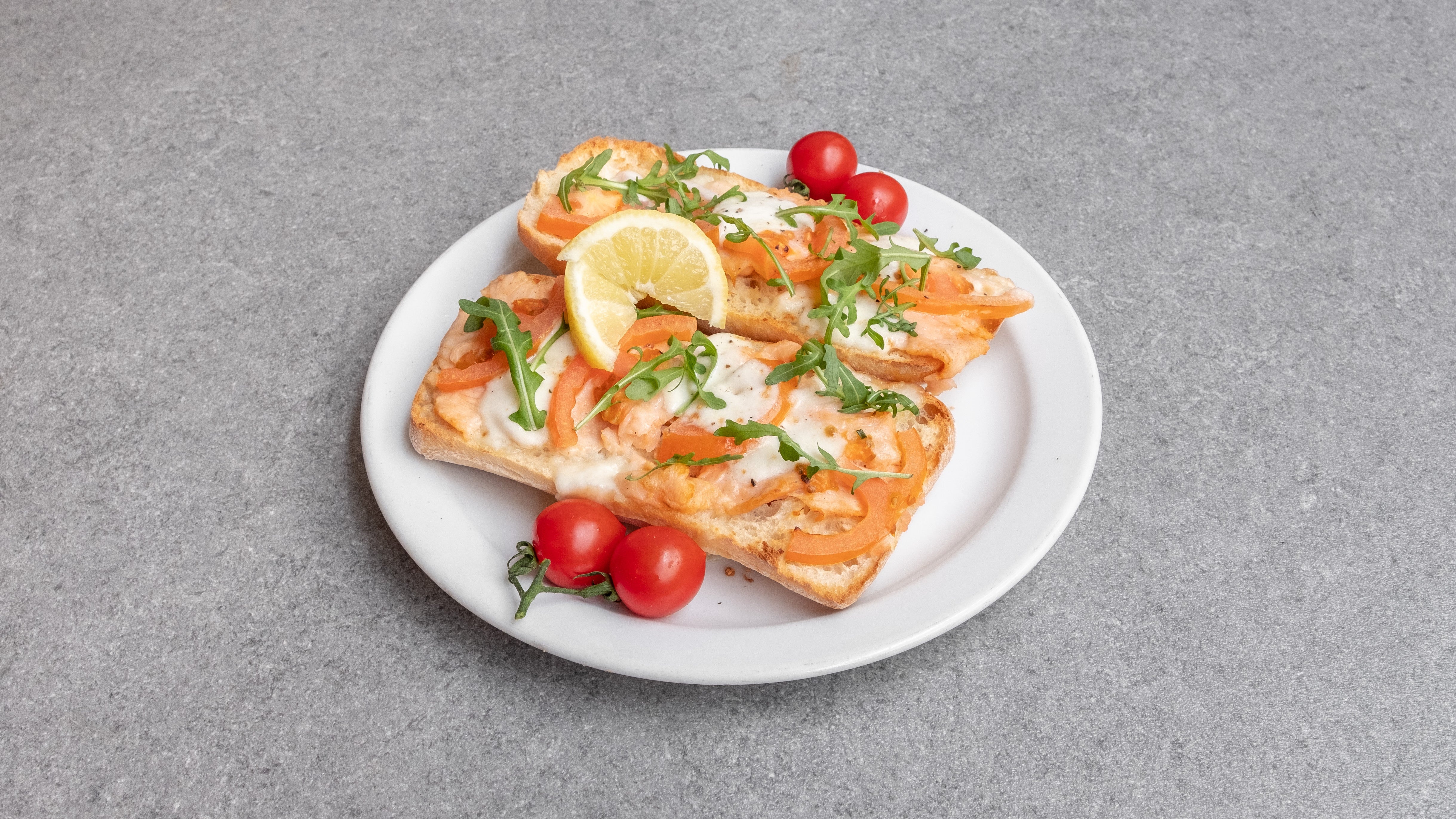 Smoked Salmon With Fresh Melted Mozzarella And Tomatoes On Ciabatta