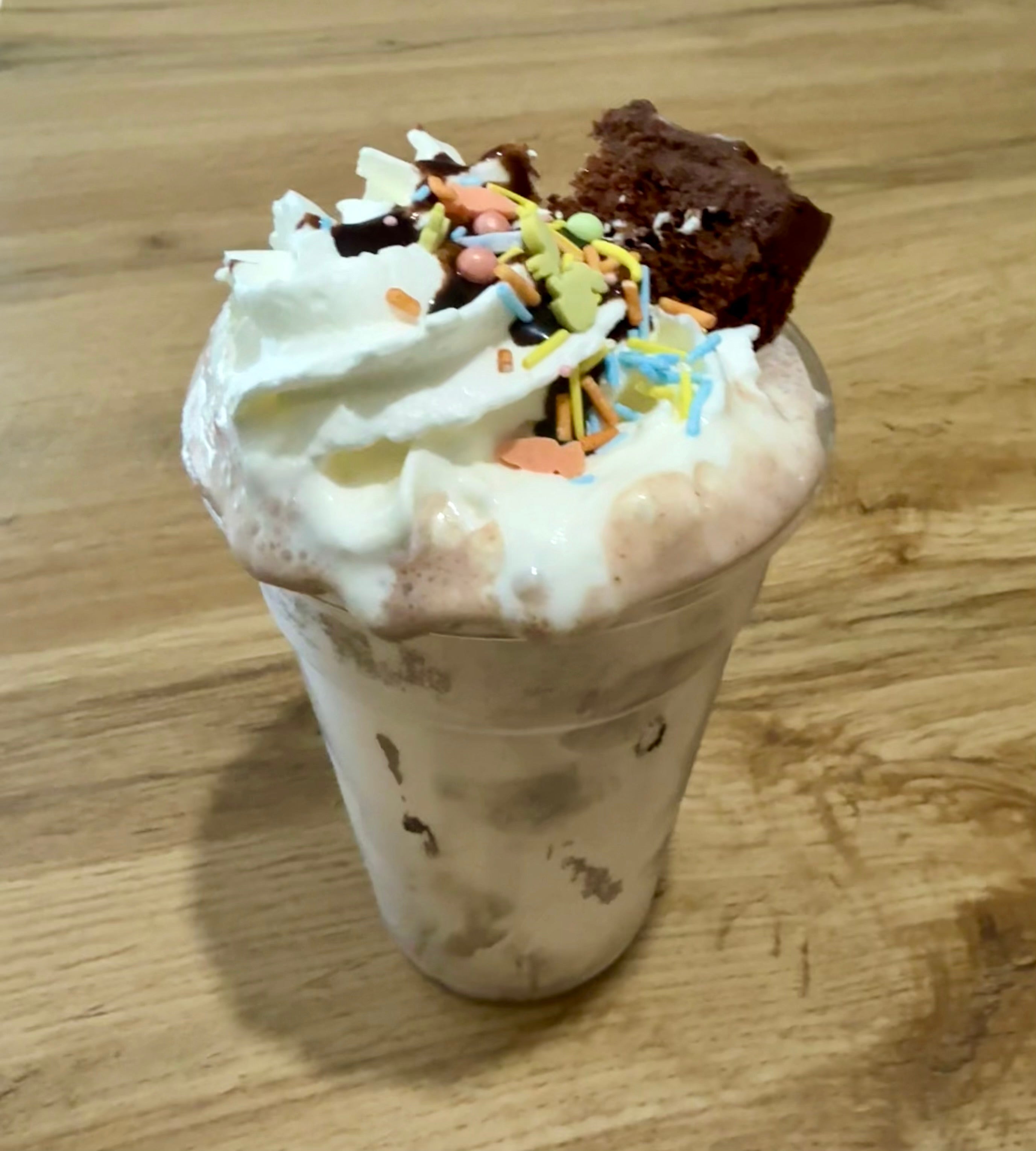 Chocolate cake shake with cream and sprinkles