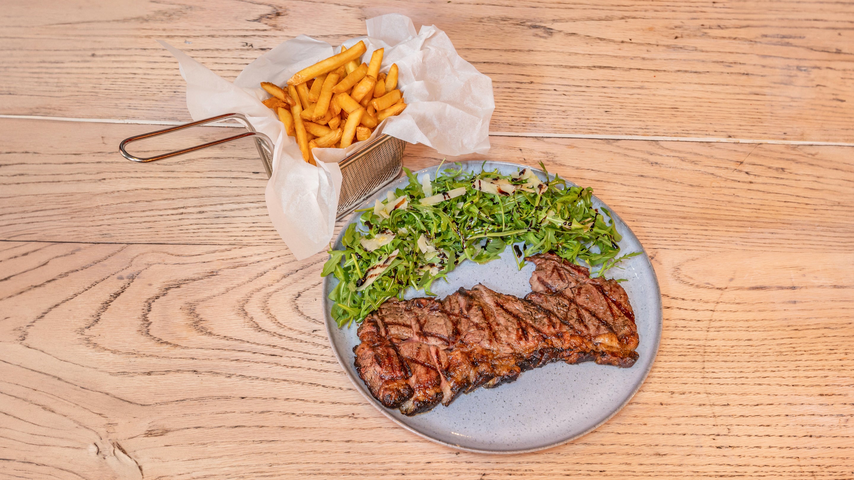 Grilled beef tagliata with rocket and parmesan cheese