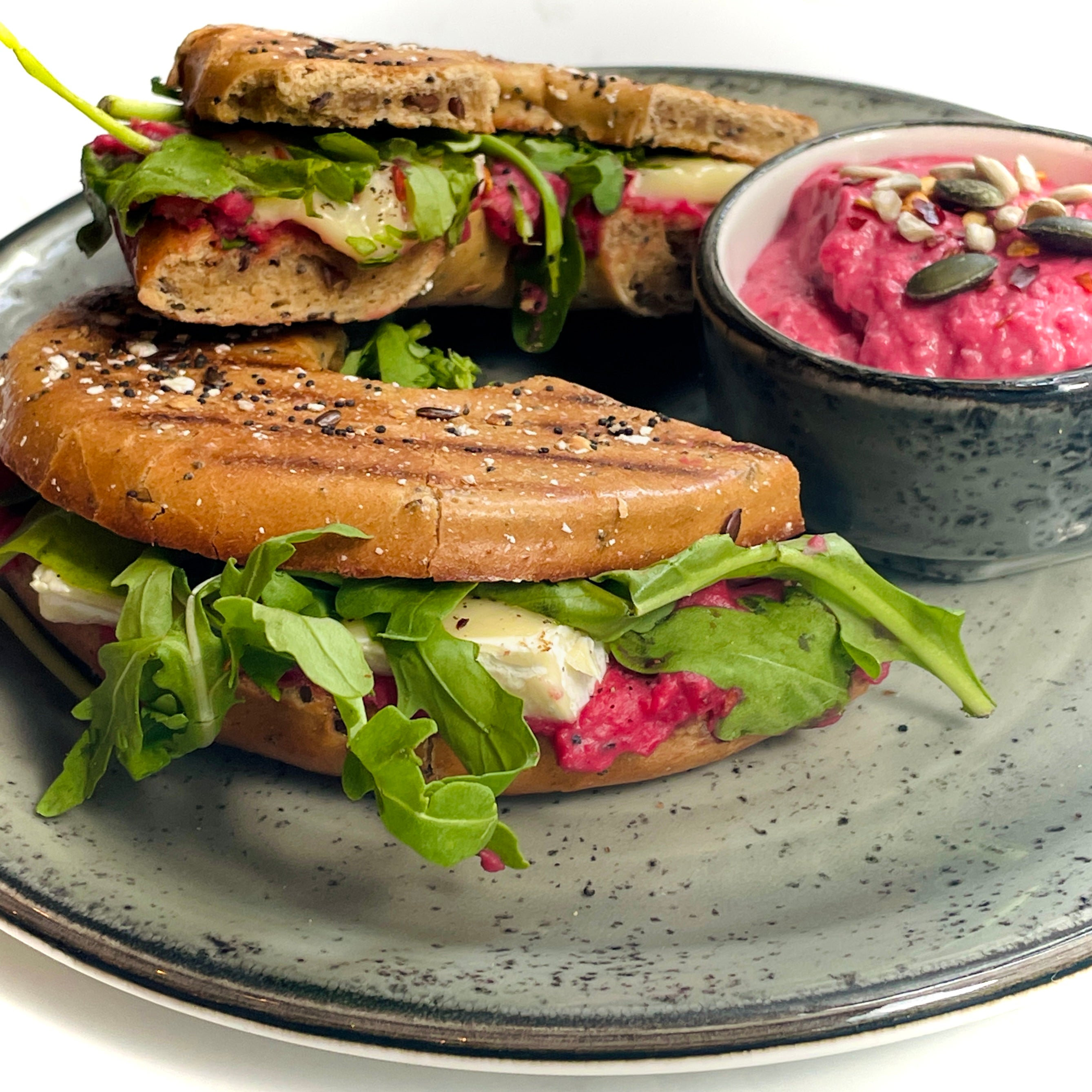 Beetroot houmous and goats cheese bagel