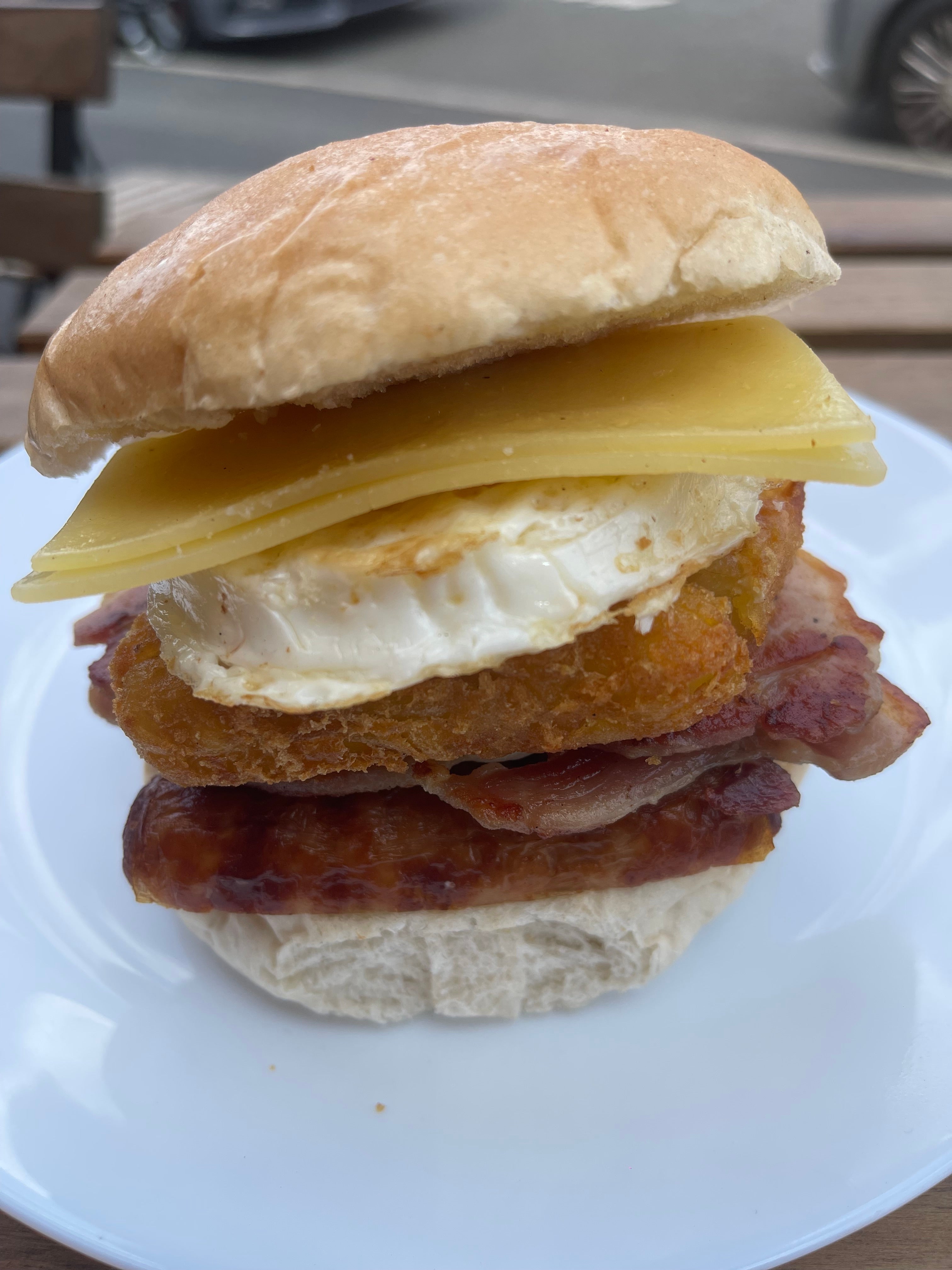Sausage, bacon,egg,hash brown and cheese  barm
