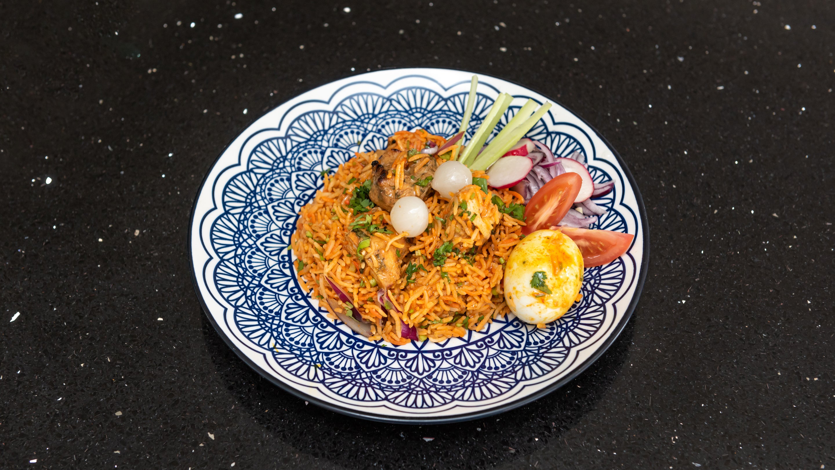 Chicken Tikka Biryani Served with Egg & Raita