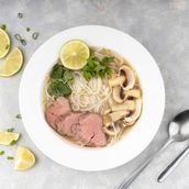 Beef Broth Soup With Rice Noodles And Mushrooms