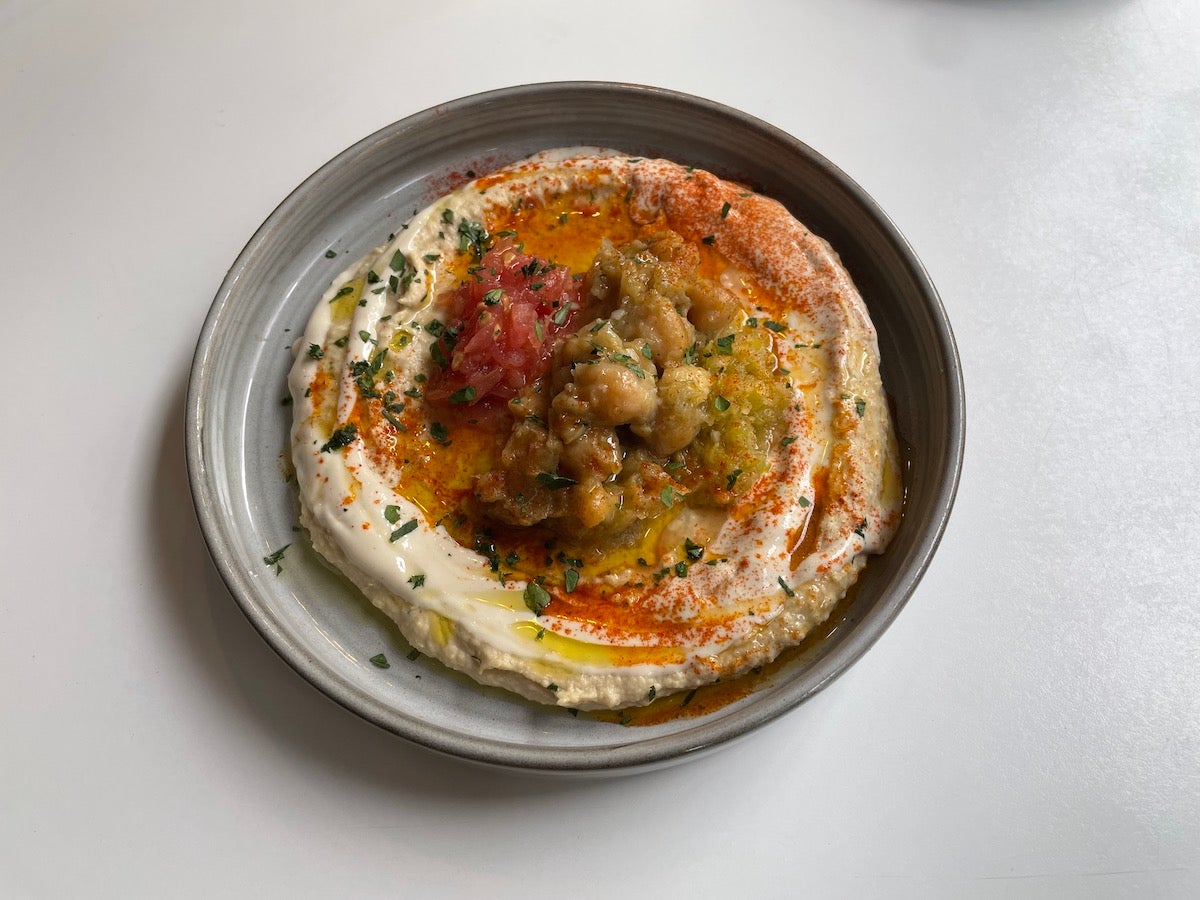 Hummus, Slow-cooked Chickpeas, Grated Tomato, Shifka Peppers (spicy) with Pita
