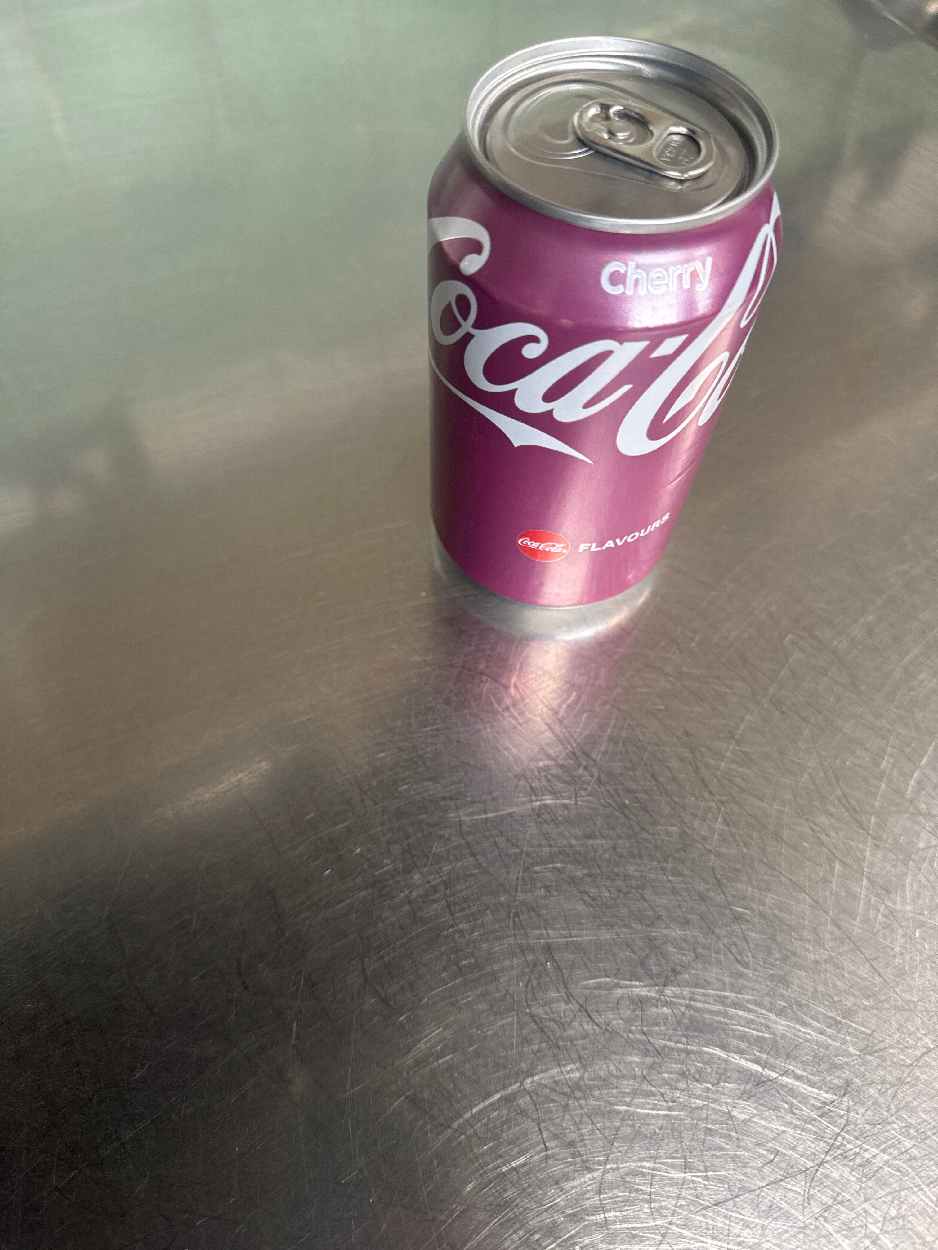 Cherry coke can of pop