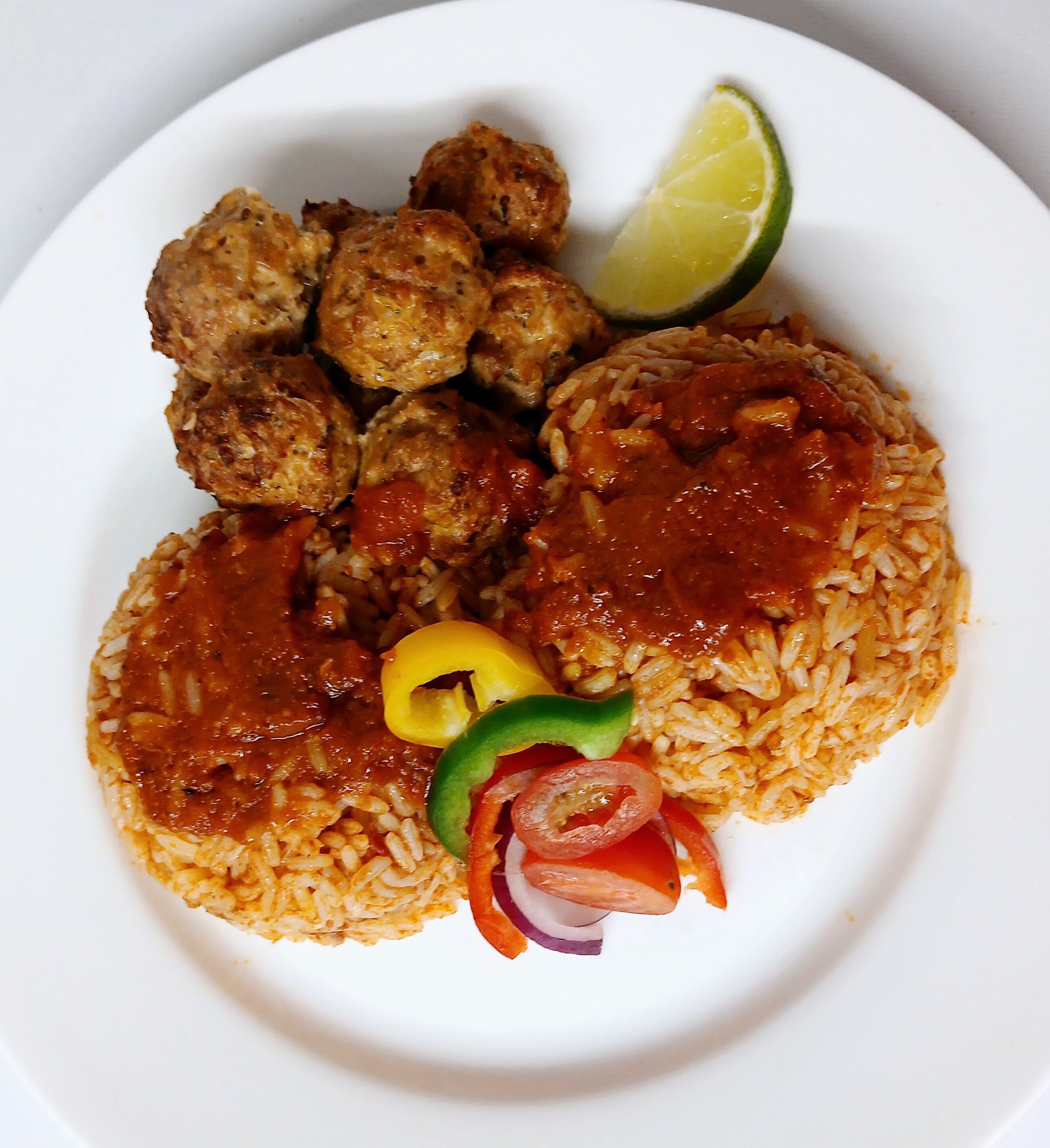 Jollof rice with creole chicken balls