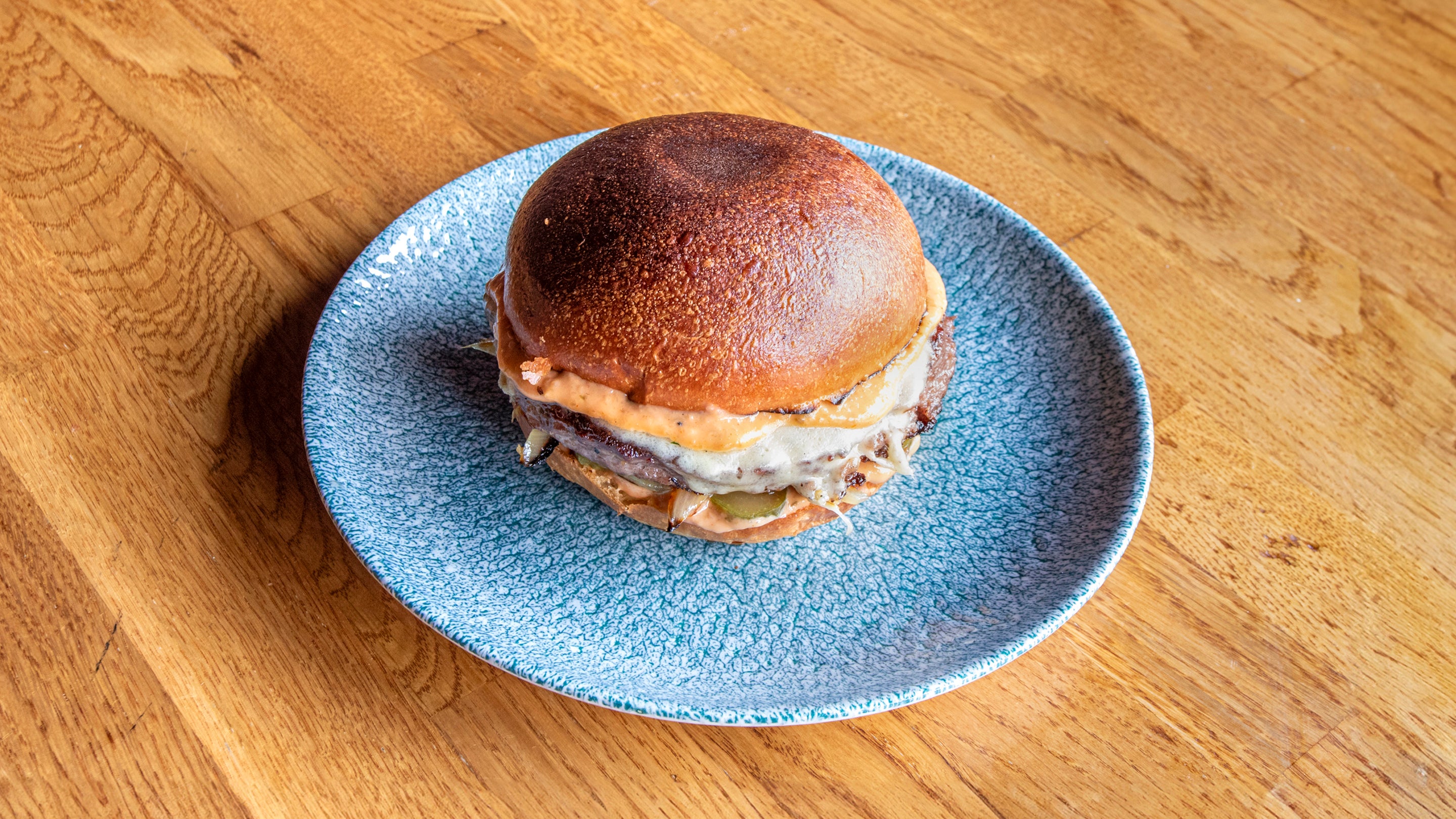 Dry-Aged Beef Patty with Lancashire Cheese, Pickles, Onions and Burger Sauce