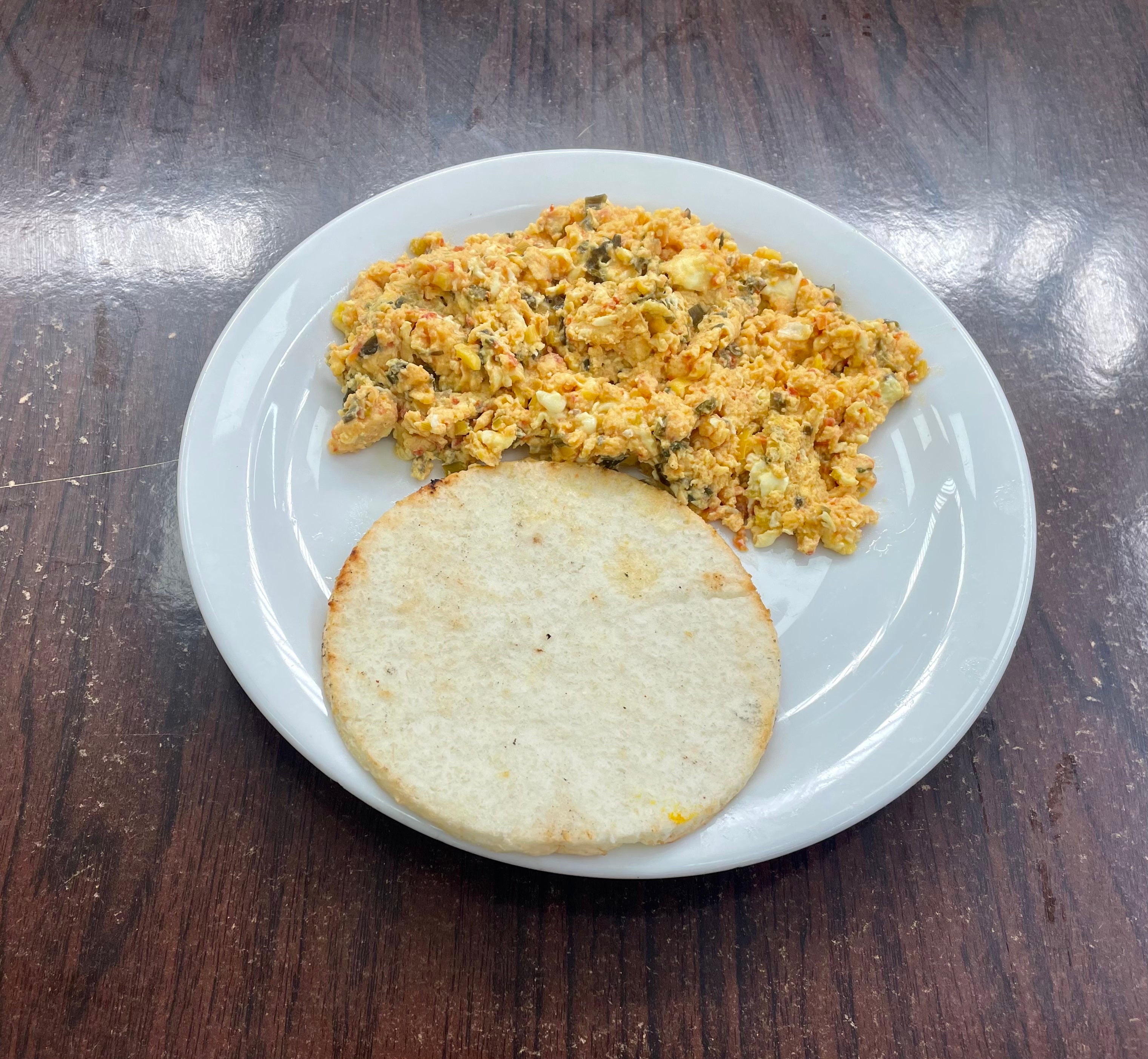 Arepa Con Huevos Pericos (Cornbread, Scramble Eggs with Tomato and Onion)