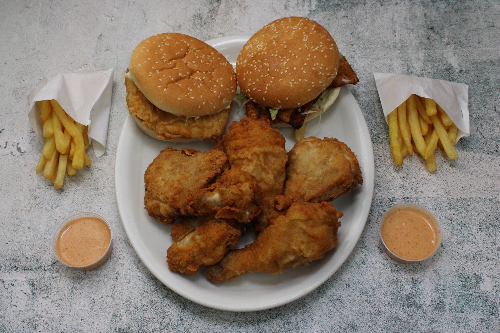 1 Grilled Chicken Burger, 1 Mustard Grilled Chicken Burger, 4 Pieces Chicken, 4 Wings, 2 Regular Fries, and Special C...