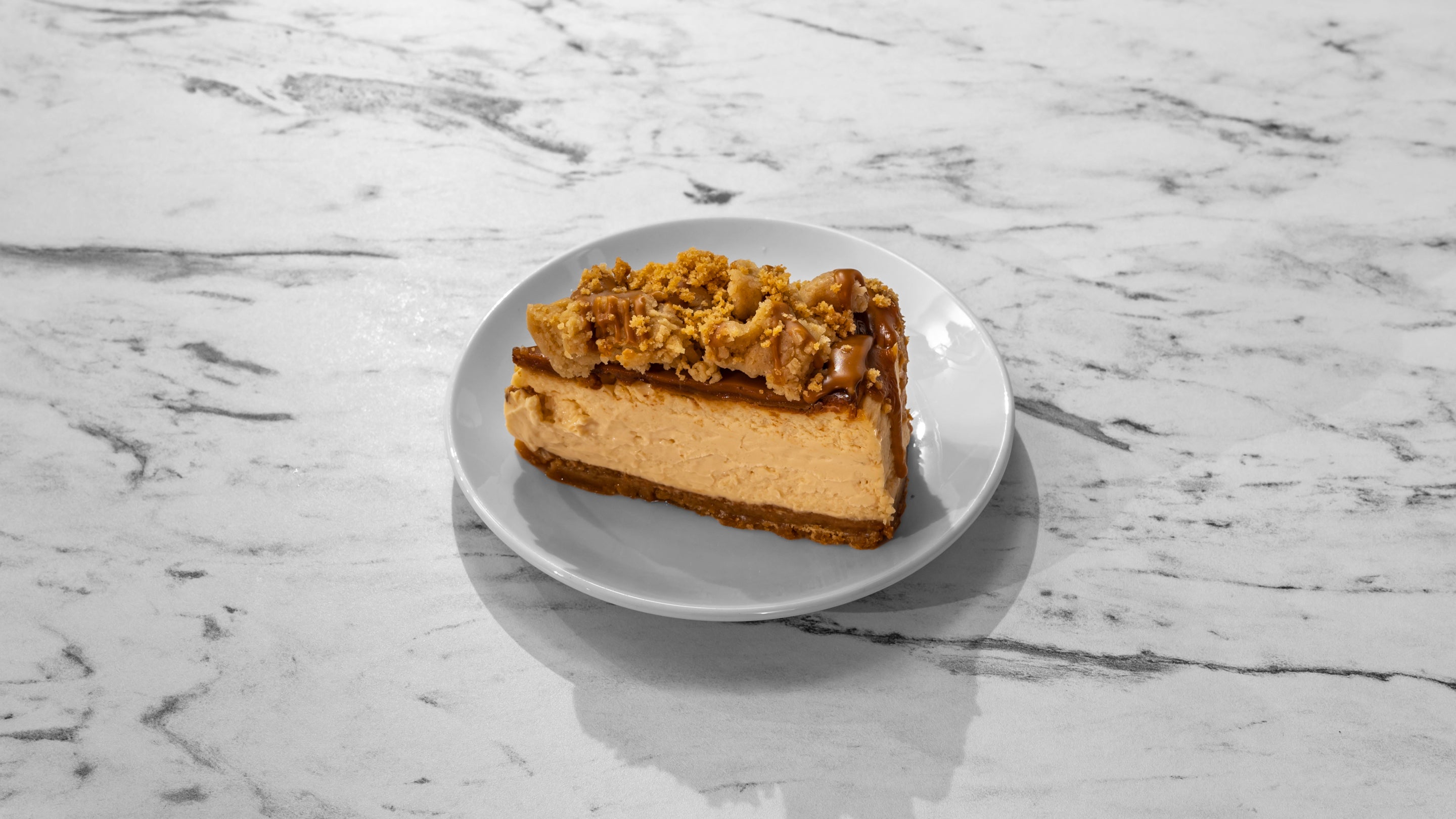 Dulce De Leche, Biscoff, and Cookie Dough Cheesecake