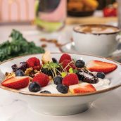 Home Made Granola with Greek Yogurt Topped with Fresh Berries