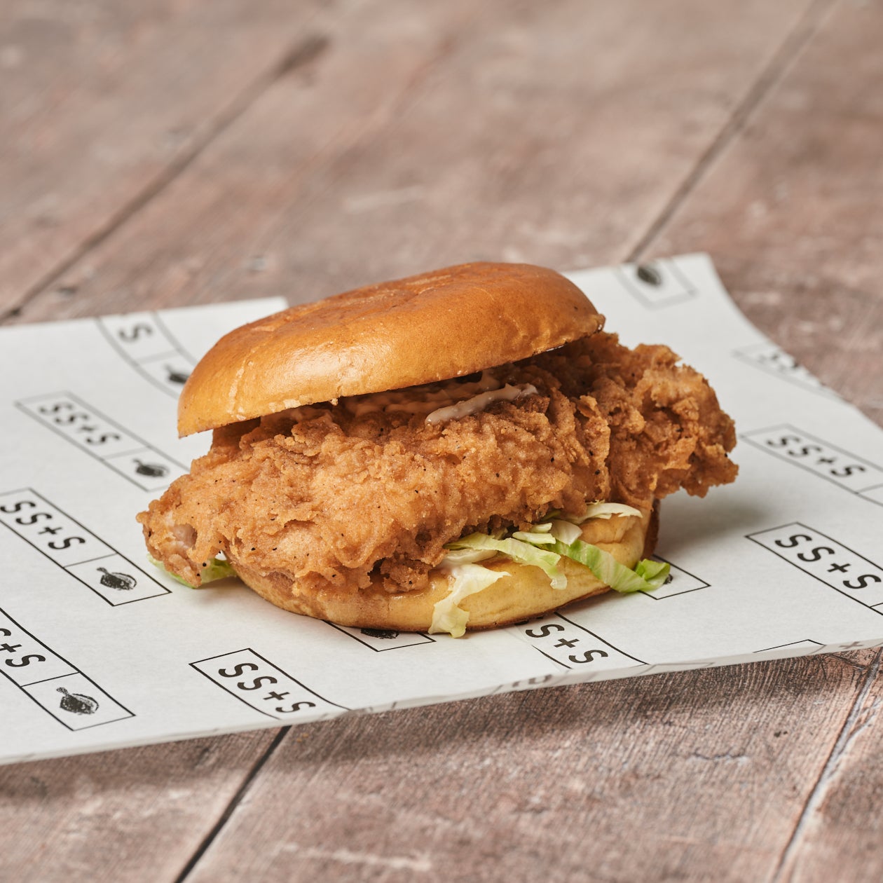 Crispy coated chicken fillet burger