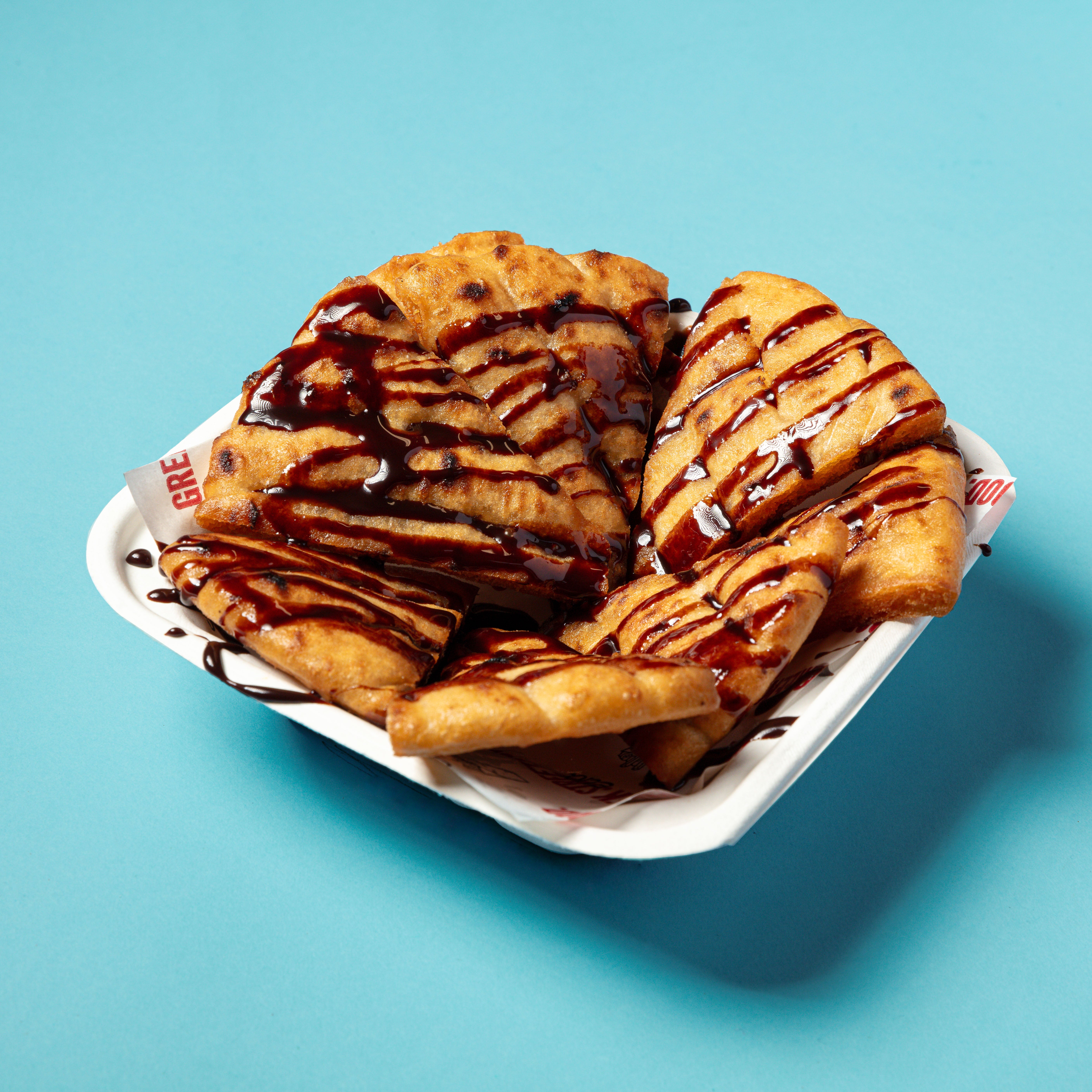 Sweet Pittaki With Chocolate Syrup