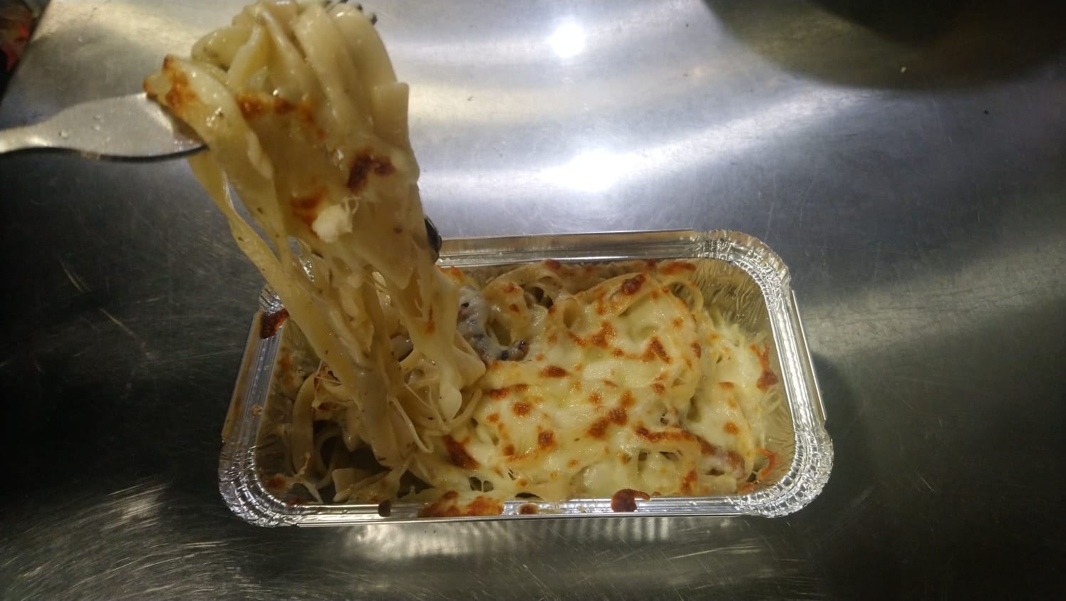 Seafood with Baked Tagliatelle Pasta in Herb Cream saurce