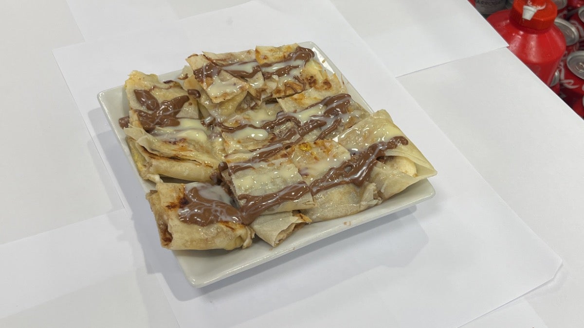 Thai style pancake with banana and chocolate sauce