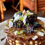 Emirati Pancakes With Chocolate Sauce And Berries
